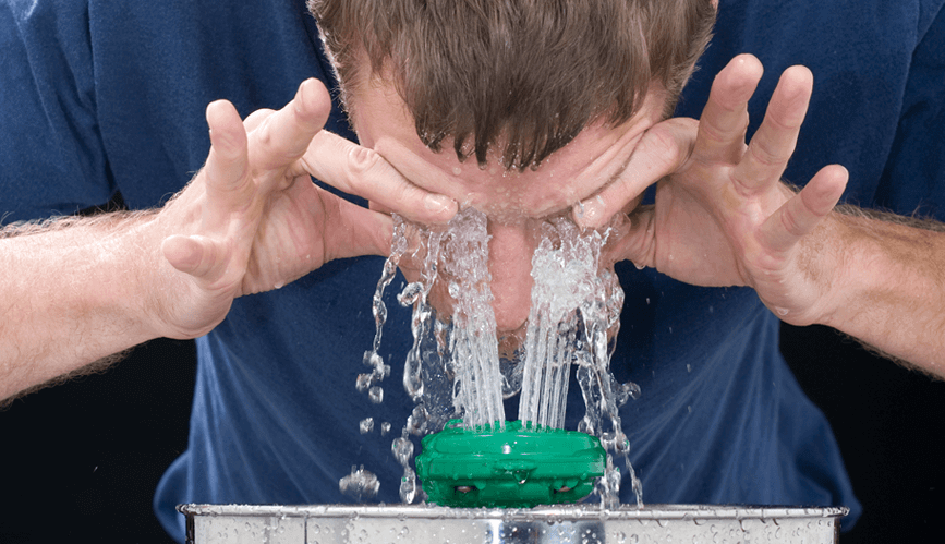 washing the eye out with clean water